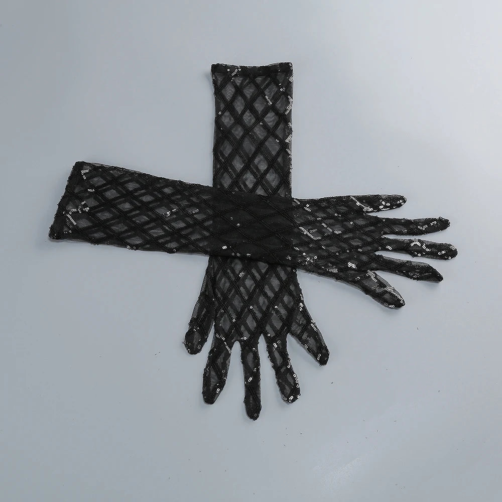 Black fishnet gloves with sequins on a light gray background