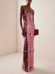 Rose gold sequin bodycon maxi dress with spaghetti straps.