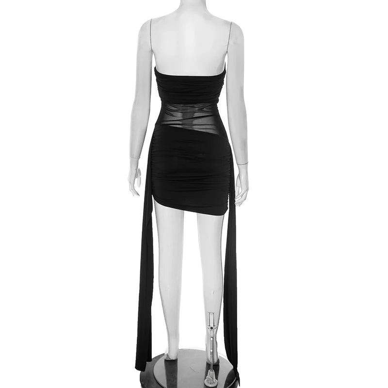 Black dress with sheer panels on a mannequin against a white background