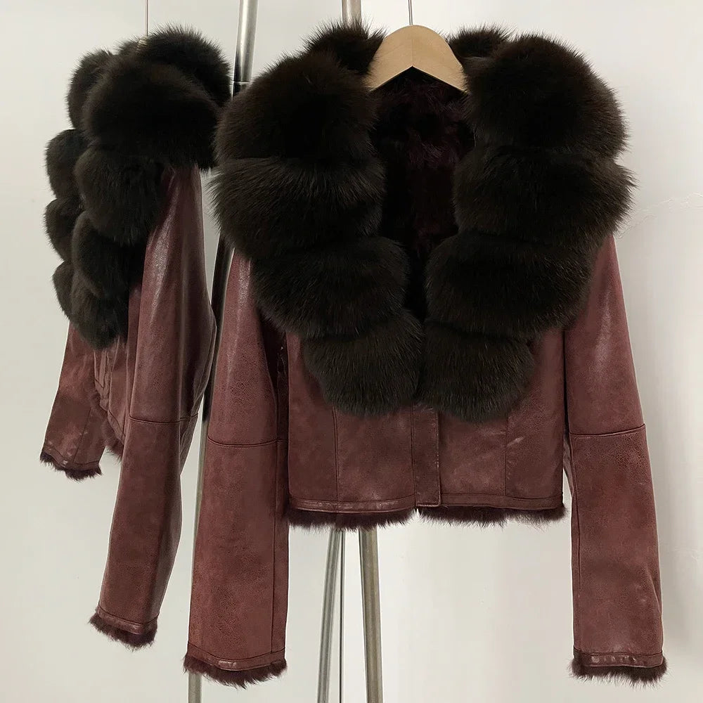 Brown leather jacket with black fur collar on a hanger against a white background