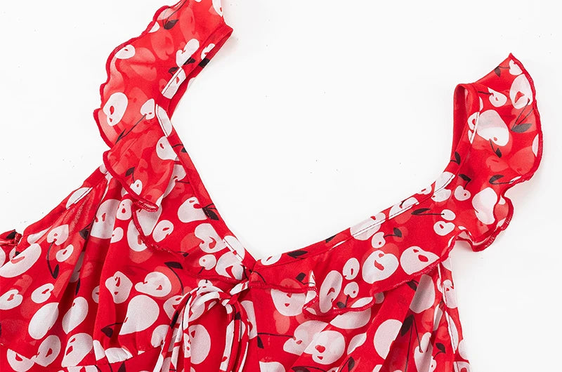 Close-up of the ruffled neckline and tie detail on a red midi dress