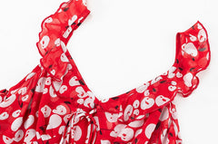 Close-up of the ruffled neckline and tie detail on a red midi dress