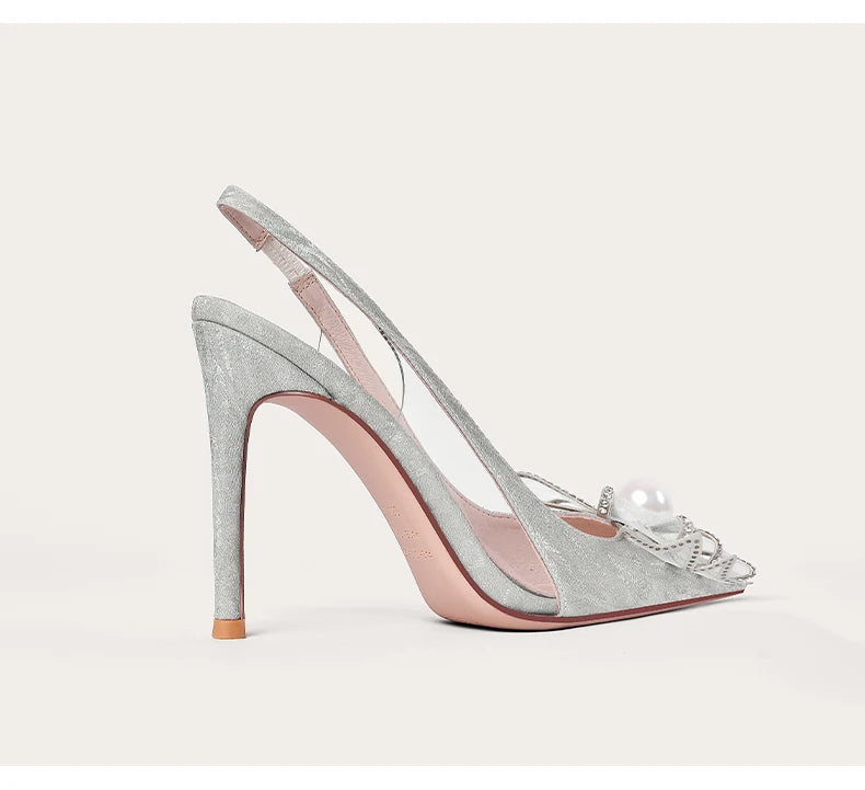 Silver high-heeled sandal with a clear strap on a white background