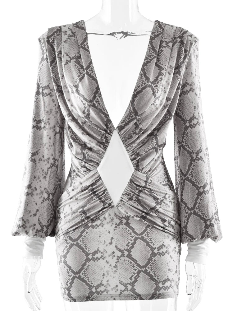 Snakeskin patterned dress on a mannequin with a white background