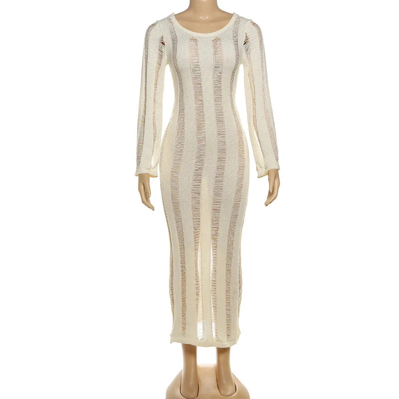 Mannequin wearing a long, sheer beige dress