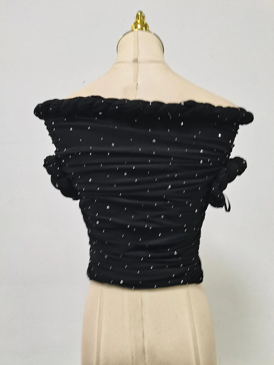 Black off-shoulder top with ruched details on a mannequin against a gray background