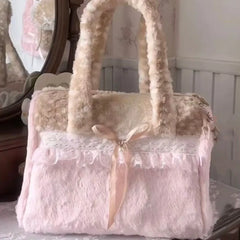 Plush lace bow shoulder bag on a dresser