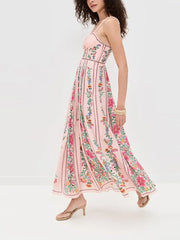 Woman wearing a pink floral dress on a white background