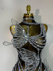 Close-up on the bodice of a crystal butterfly mini dress