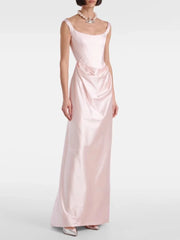 Woman wearing a pink satin gown on a white background