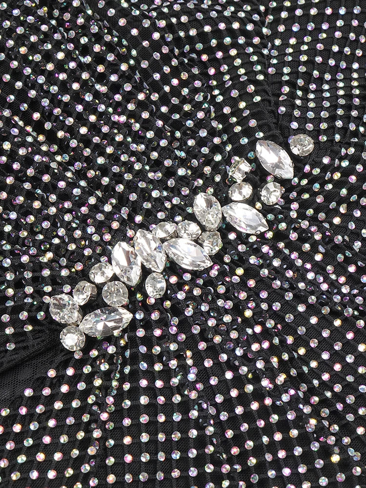 Close-up of a black fabric with crystal embellishments