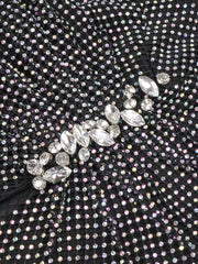 Close-up of a black fabric with crystal embellishments