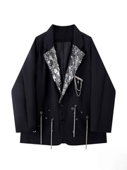 Black jacket with silver sequin details on a white background