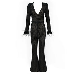 Black patterned jumpsuit with feathered cuffs on a white background