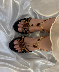 Overhead view of beaded embellished t-strap stiletto heels