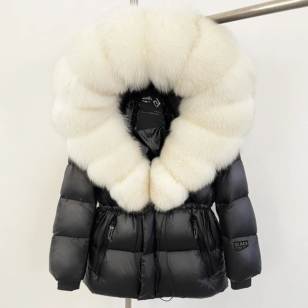 Black puffer jacket with large white fur collar on a mannequin against a white background