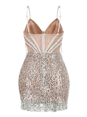 Beige sequin dress with thin straps on a white background