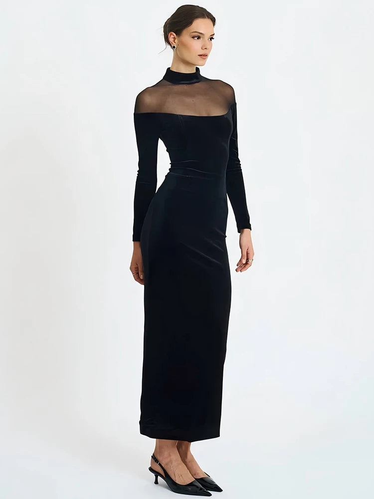 Black dress with sheer sleeves on a white background