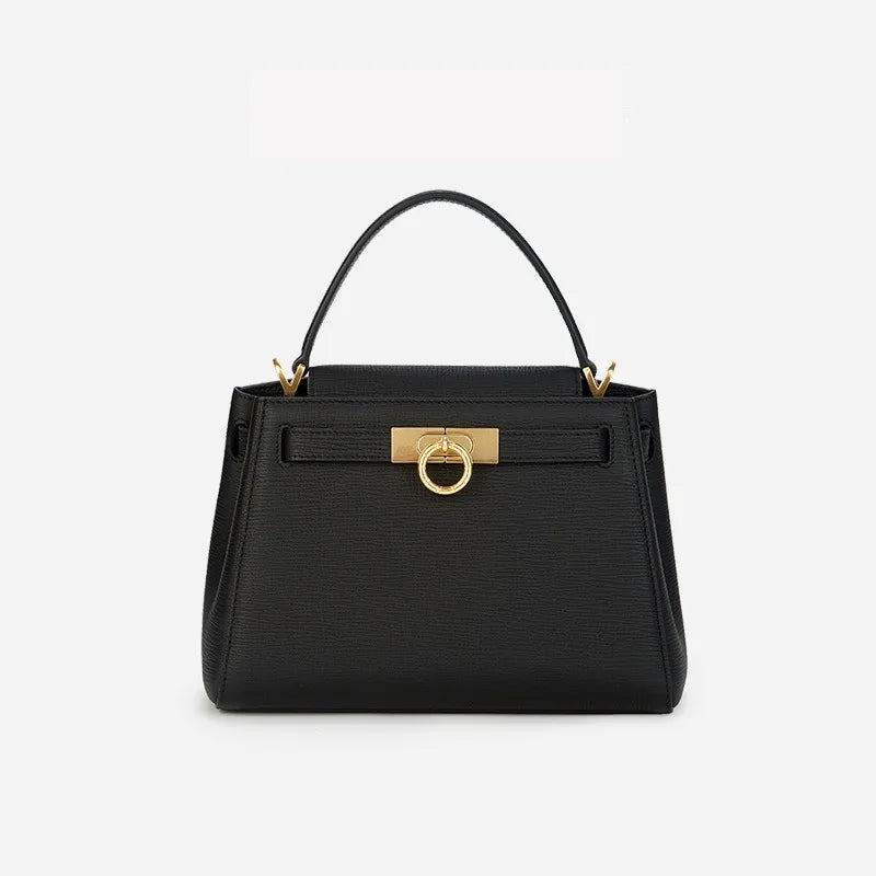 Black structured top handle bag with gold-tone hardware.