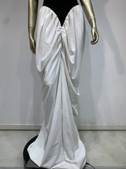 Mannequin wearing a white satin gown with a black bodice against a plain background