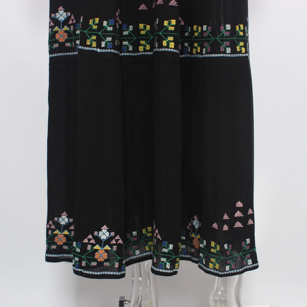 Black dress with colorful geometric embroidery