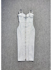 White strapless dress with ruched details on a textured gray background