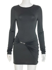 Black long-sleeve dress with a ruched design on a mannequin against a white background