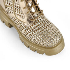 Close-up of the toe on gold mesh platform lace-up ankle boots