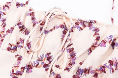 Detail of tie-front and pattern on square neck A-line dress