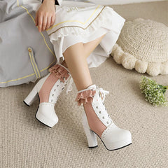 White lace-up platform boots worn by a person sitting on a beige carpet.