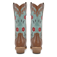 Pair of cowboy boots with floral design on a white background