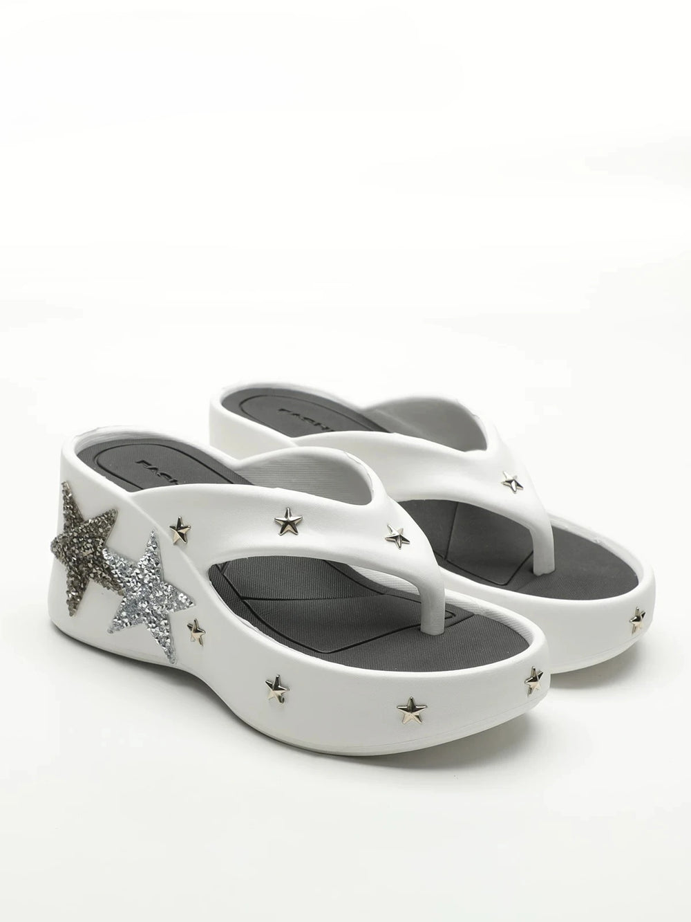 White platform wedge heels with star embellishments