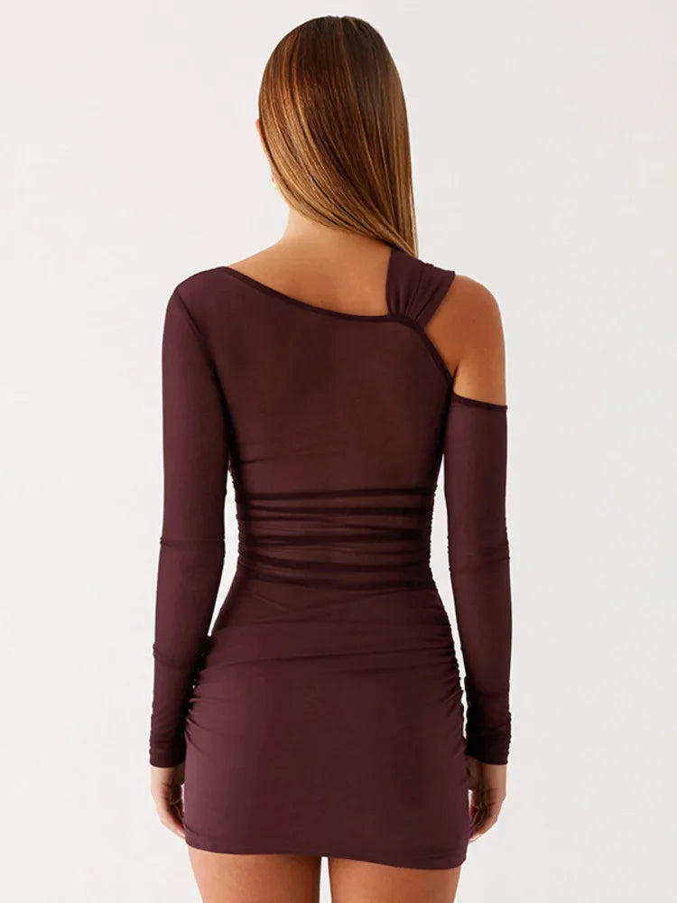 Brown dress with long sleeves and a unique back design on a white background