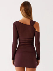 Brown dress with long sleeves and a unique back design on a white background