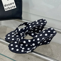 Black polka dot wedge flip-flops
