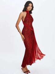 Woman wearing a red evening gown with a white background