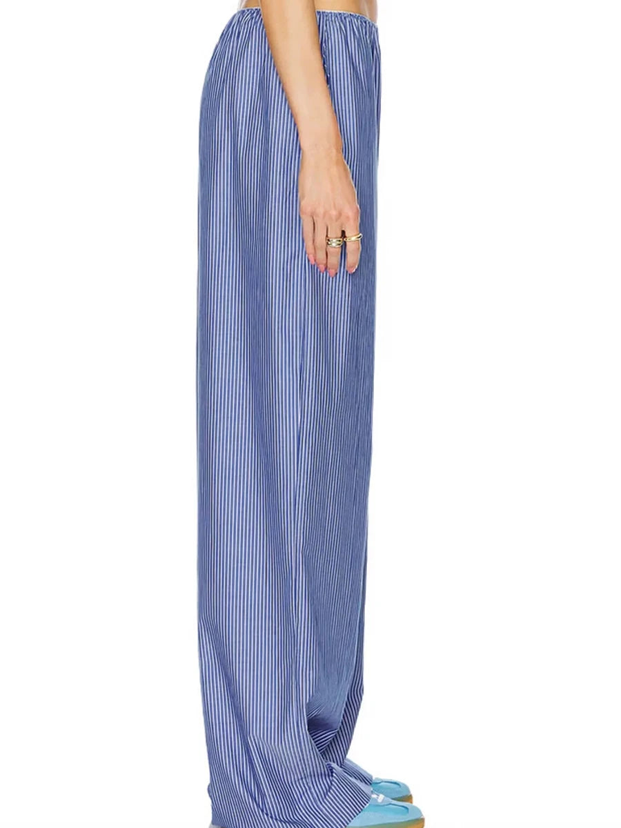 Blue striped pants worn by a person on a white background