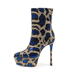 Blue and gold leopard print platform boot on a white background