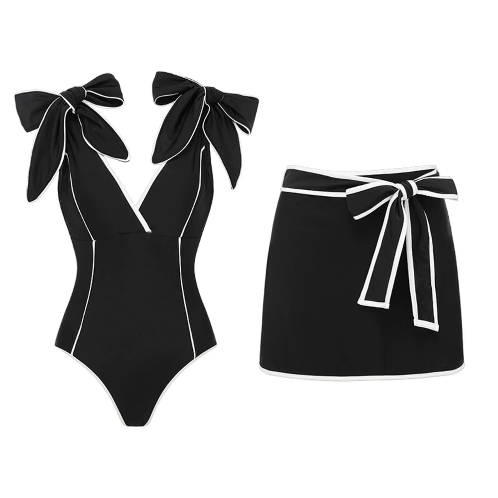 Black off-the-shoulder bow swimsuit and wrap skirt set