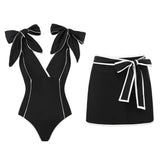 Black off-the-shoulder bow swimsuit and wrap skirt set
