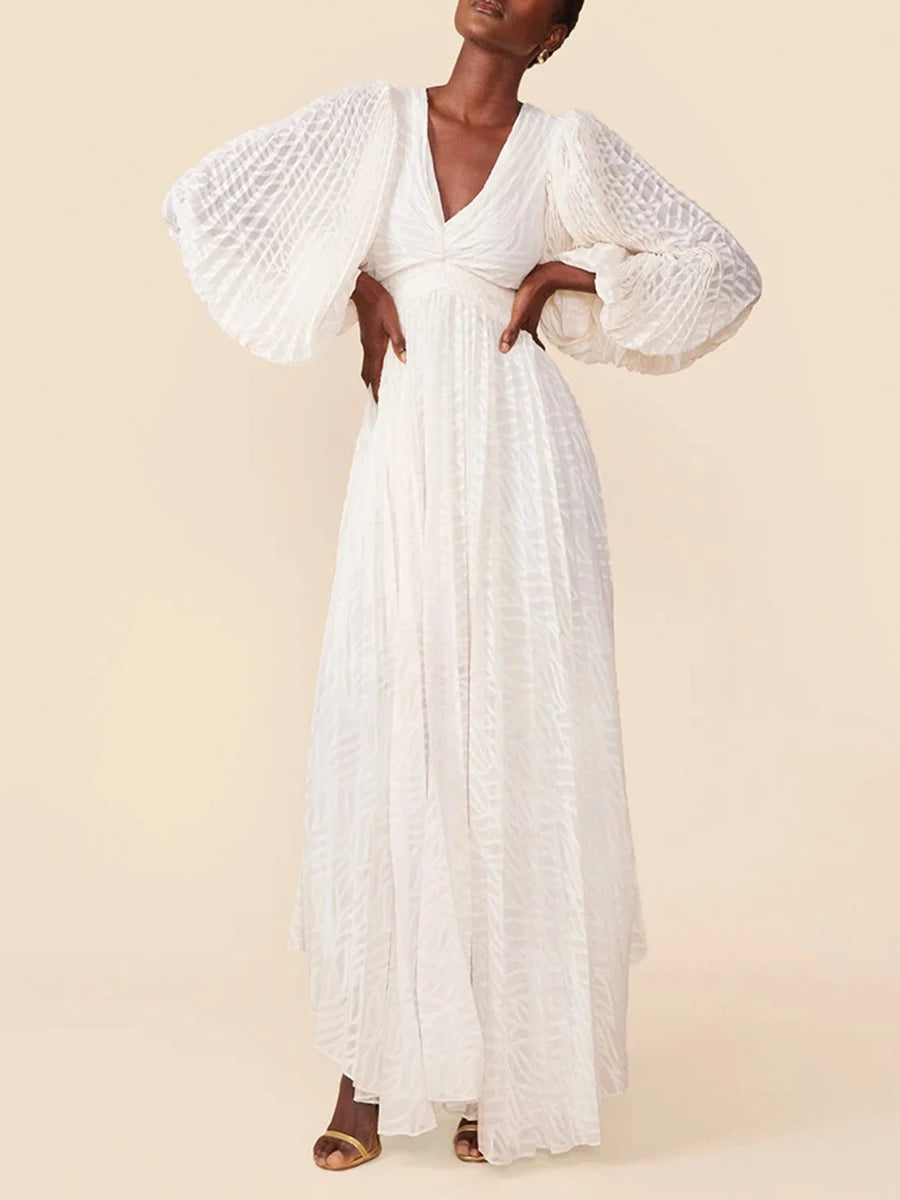 Woman wearing a white lace dress against a beige background