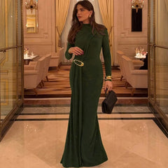 Elegant winter green evening gown shown with full sleeves and A-line flow.