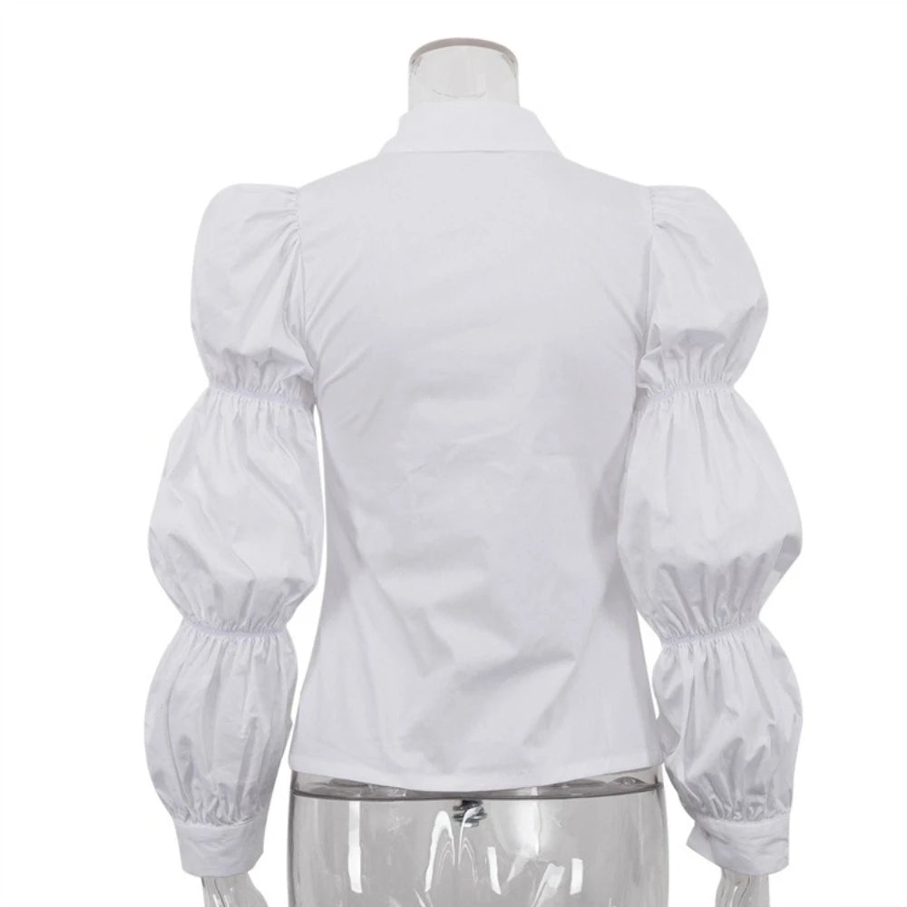 White blouse with puffed sleeves on a mannequin against a white background