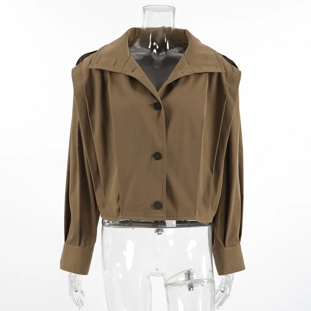 Brown jacket on a transparent mannequin against a white background