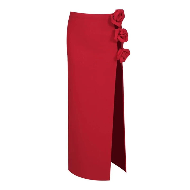 Red maxi skirt with floral embellishments and a high slit, isolated on white background