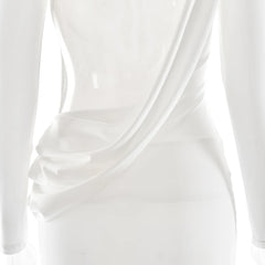 Close-up of a white satin dress with draped fabric