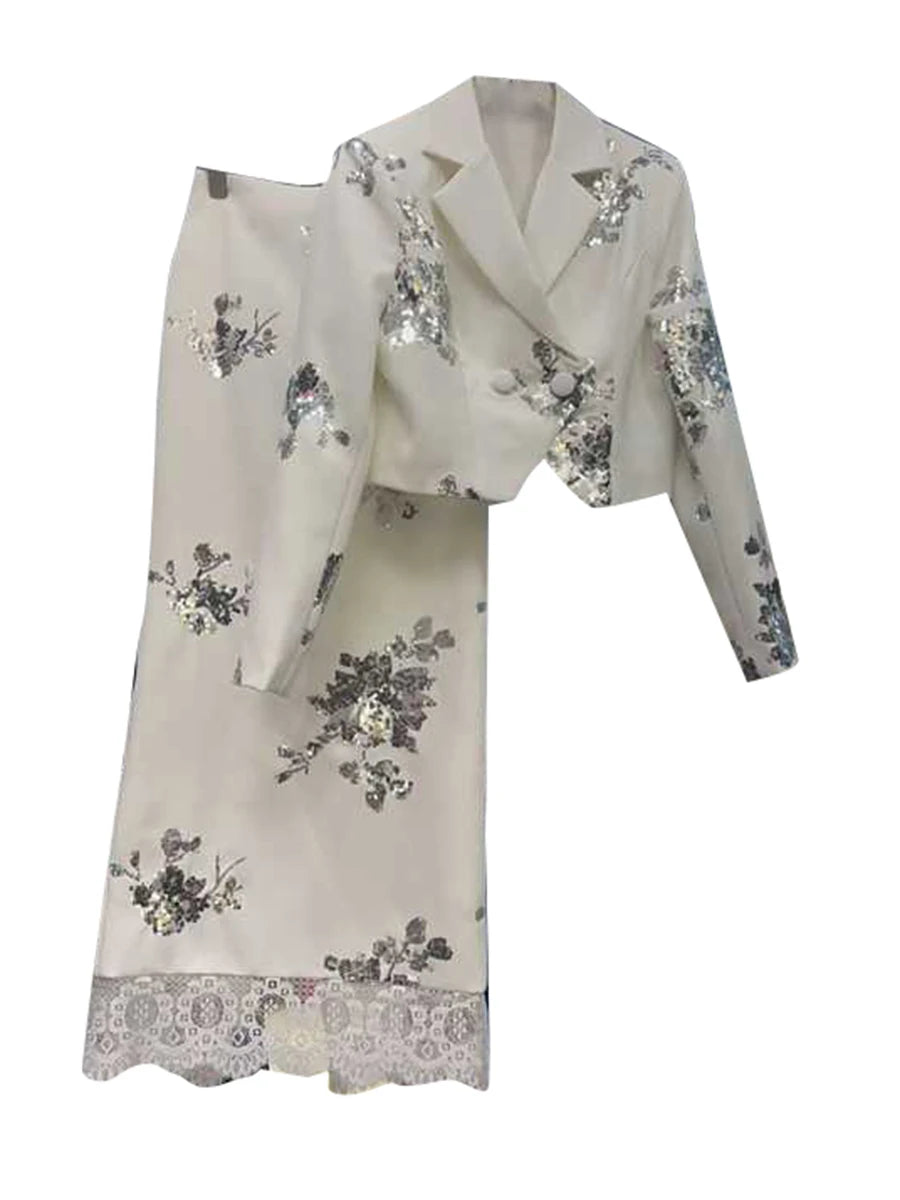 White outfit with floral patterns on a white background