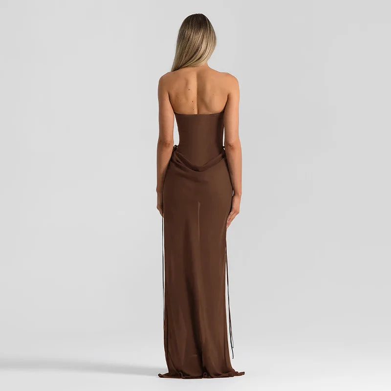 Woman wearing a brown strapless gown on a light gray background