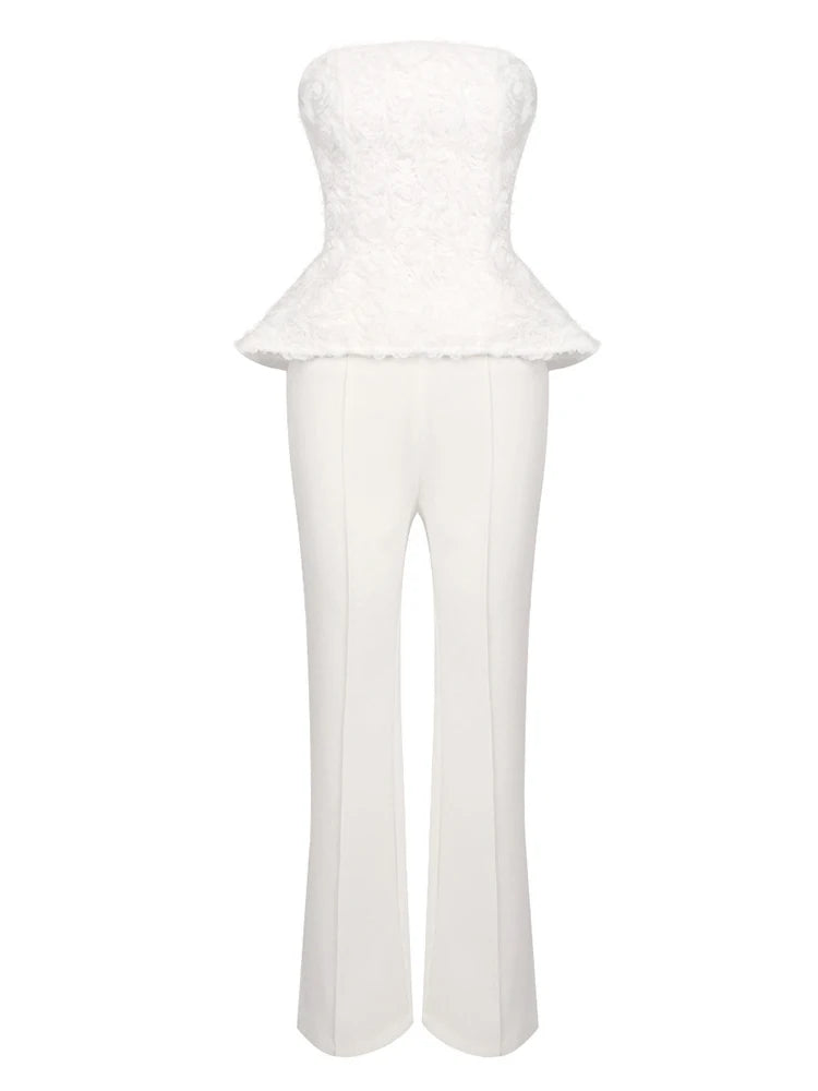 White strapless peplum top and pants set on a white background