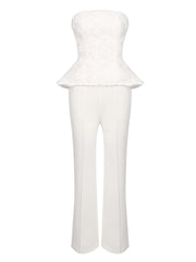 White strapless peplum top and pants set on a white background